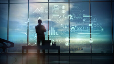Man looking into infographics on growth through Fintech localization